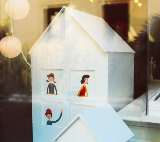 A toy house in a shop window